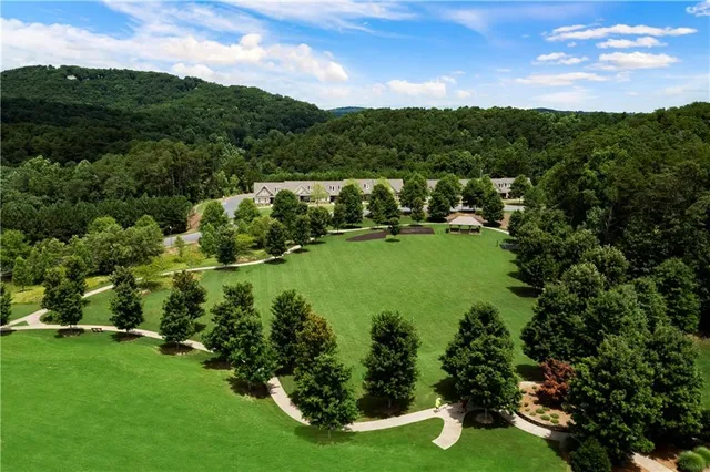 a view of swimming pool with a tree in the background