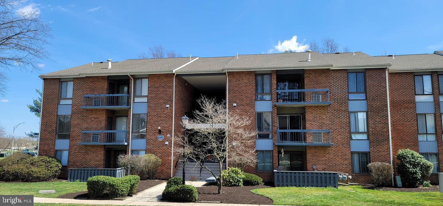 114 Van Buren Road, Unit 5 Voorhees, NJ 08043 - Photo 1 of 11 a front view of a house with a yard