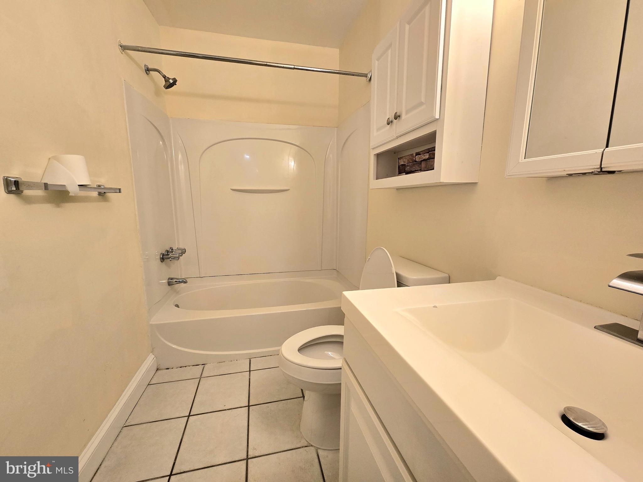 114 Van Buren Road, Unit 5 Voorhees, NJ 08043 - Photo 11 of 13 a bathroom with a granite countertop sink toilet and shower