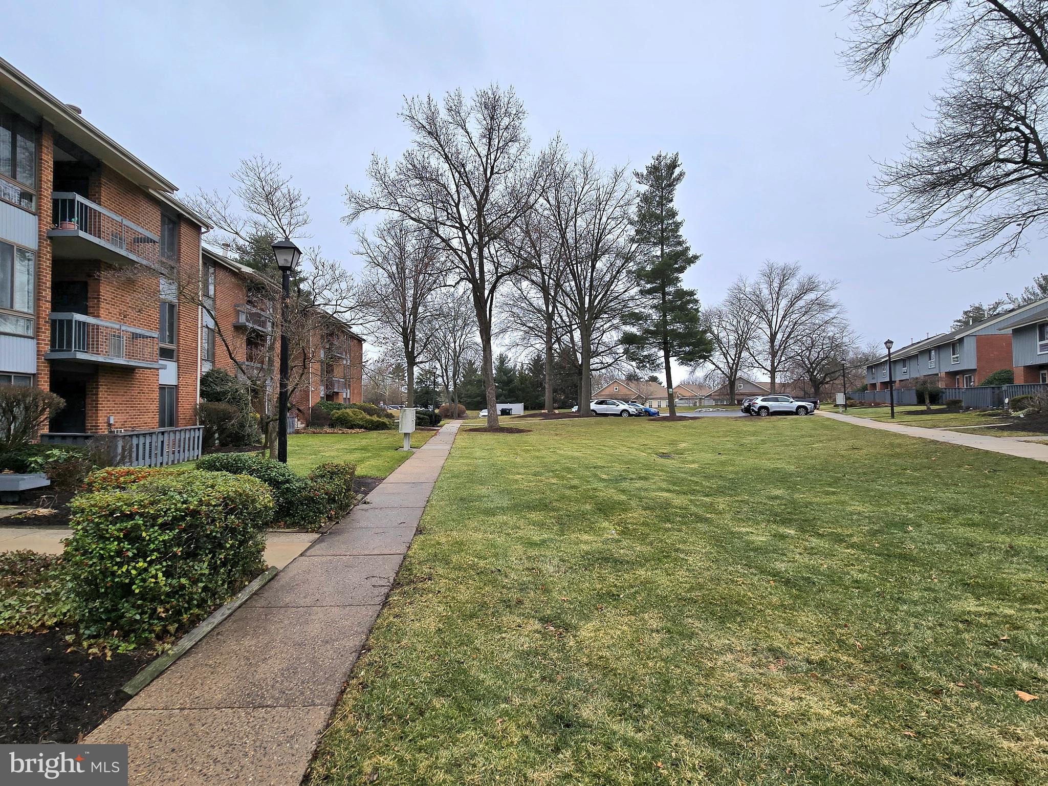 114 Van Buren Road, Unit 5 Voorhees, NJ 08043 - Photo 2 of 13 a view of a yard with plants and trees