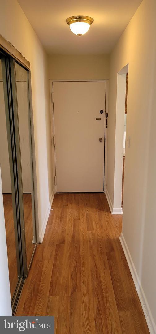 114 Van Buren Road, Unit 5 Voorhees, NJ 08043 - Photo 2 of 11 a view of a hallway with wooden floor