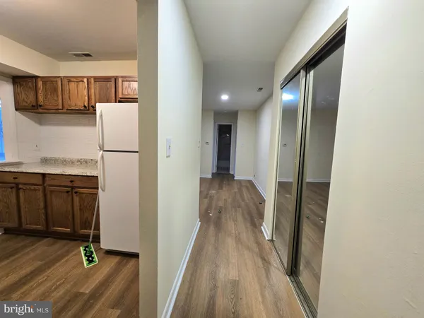 a view of a kitchen from the hallway