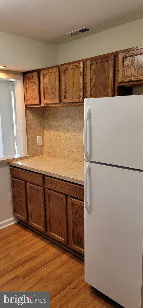 114 Van Buren Road, Unit 5 Voorhees, NJ 08043 - Photo 4 of 11 a white refrigerator freezer sitting in a kitchen