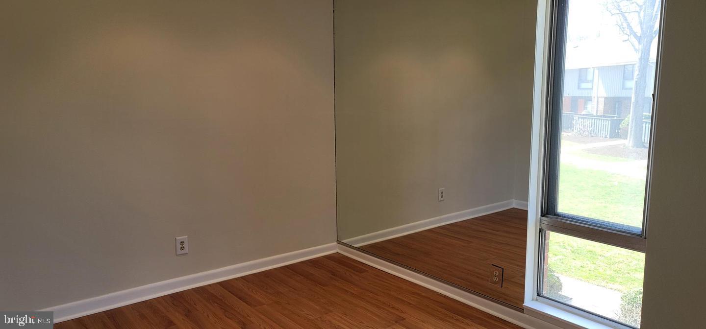 114 Van Buren Road, Unit 5 Voorhees, NJ 08043 - Photo 6 of 11 a view of an empty room and window