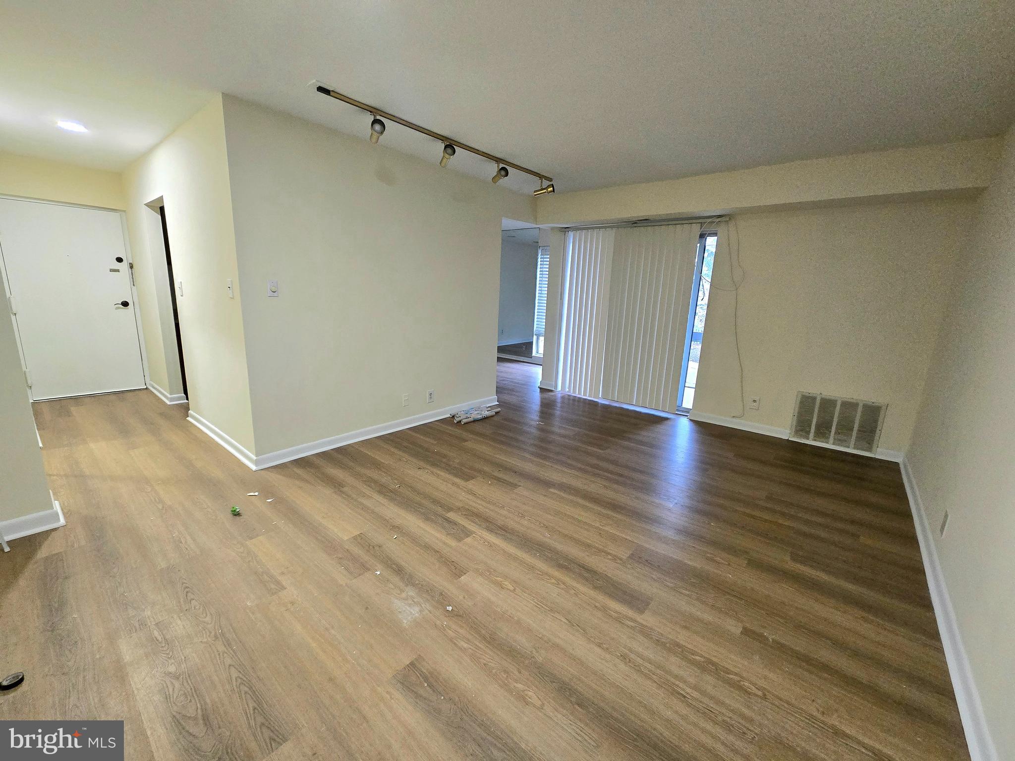 114 Van Buren Road, Unit 5 Voorhees, NJ 08043 - Photo 10 of 13 a view of an empty room with wooden floor