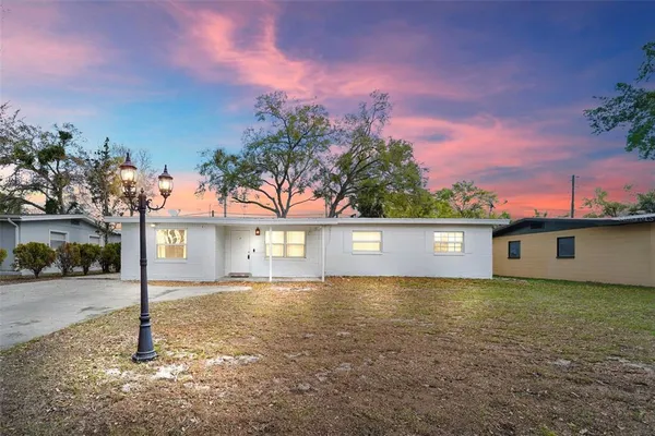 a view of a street with a building in the background