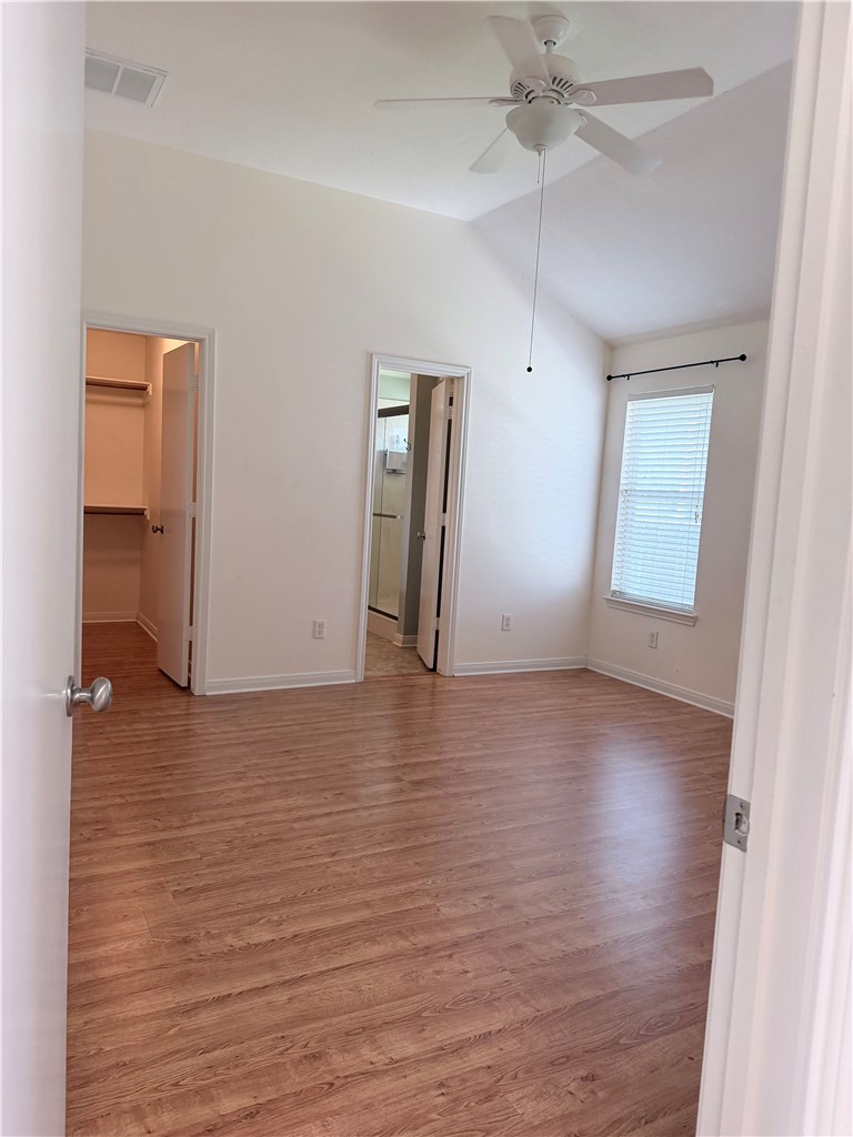 1029 Fallbrook Loop College Station, TX 77845 - Photo 12 of 34 an empty room with wooden floor and windows