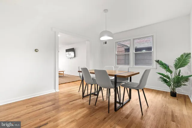 a view of table and chair in wooden floor