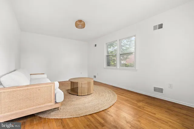 a kitchen with a refrigerator sink and cabinets