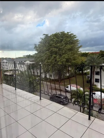 a view of a street with cars