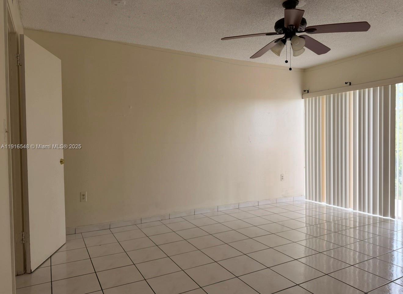 1900 West 54th Street, Unit 320 Hialeah, FL 33012 - Photo 17 of 19 a view of an empty room and a window
