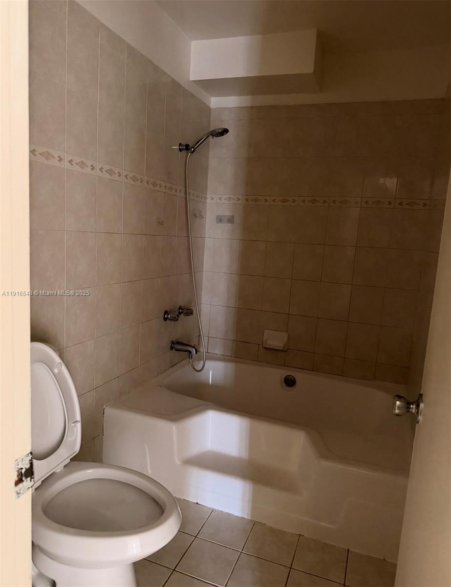 1900 West 54th Street, Unit 320 Hialeah, FL 33012 - Photo 10 of 19 a bathroom with a toilet and a shower