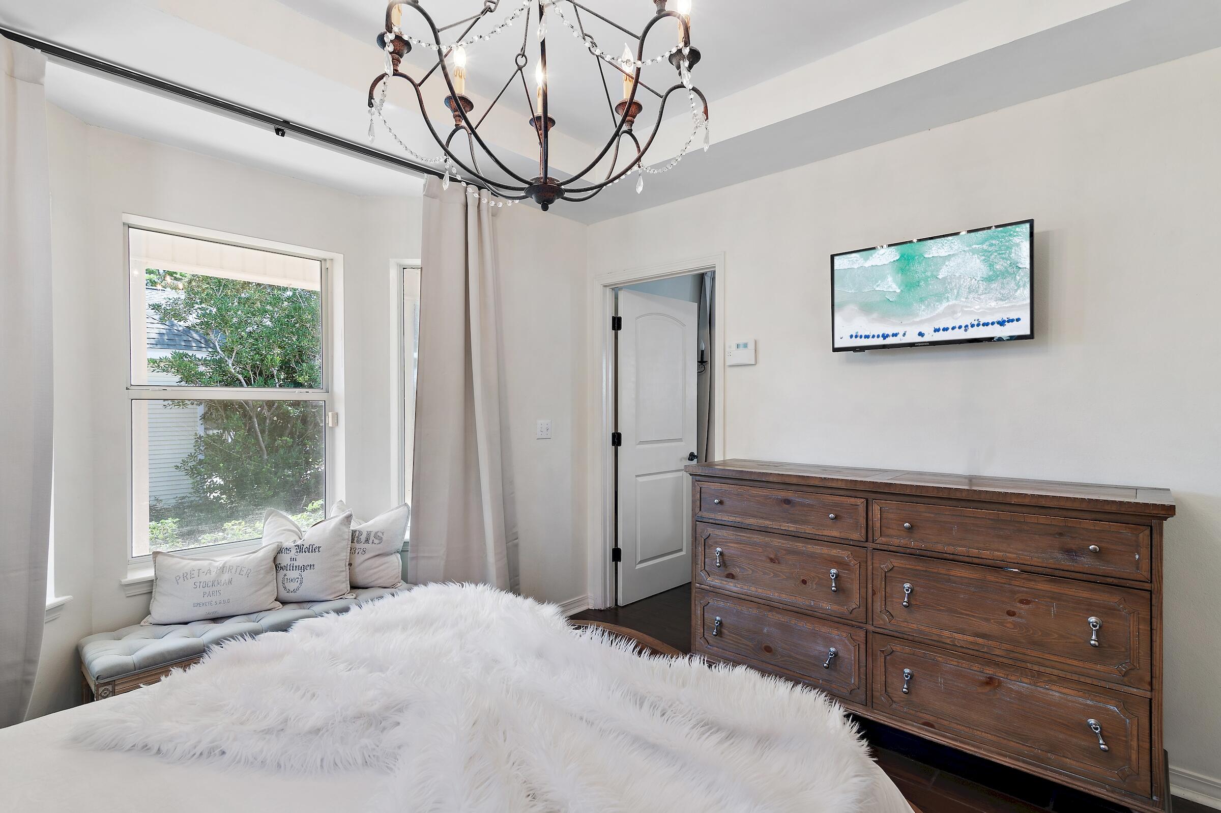 4485 Luke Avenue, Unit B Destin, FL 32541 - Photo 17 of 22 a bedroom with a bed and a window