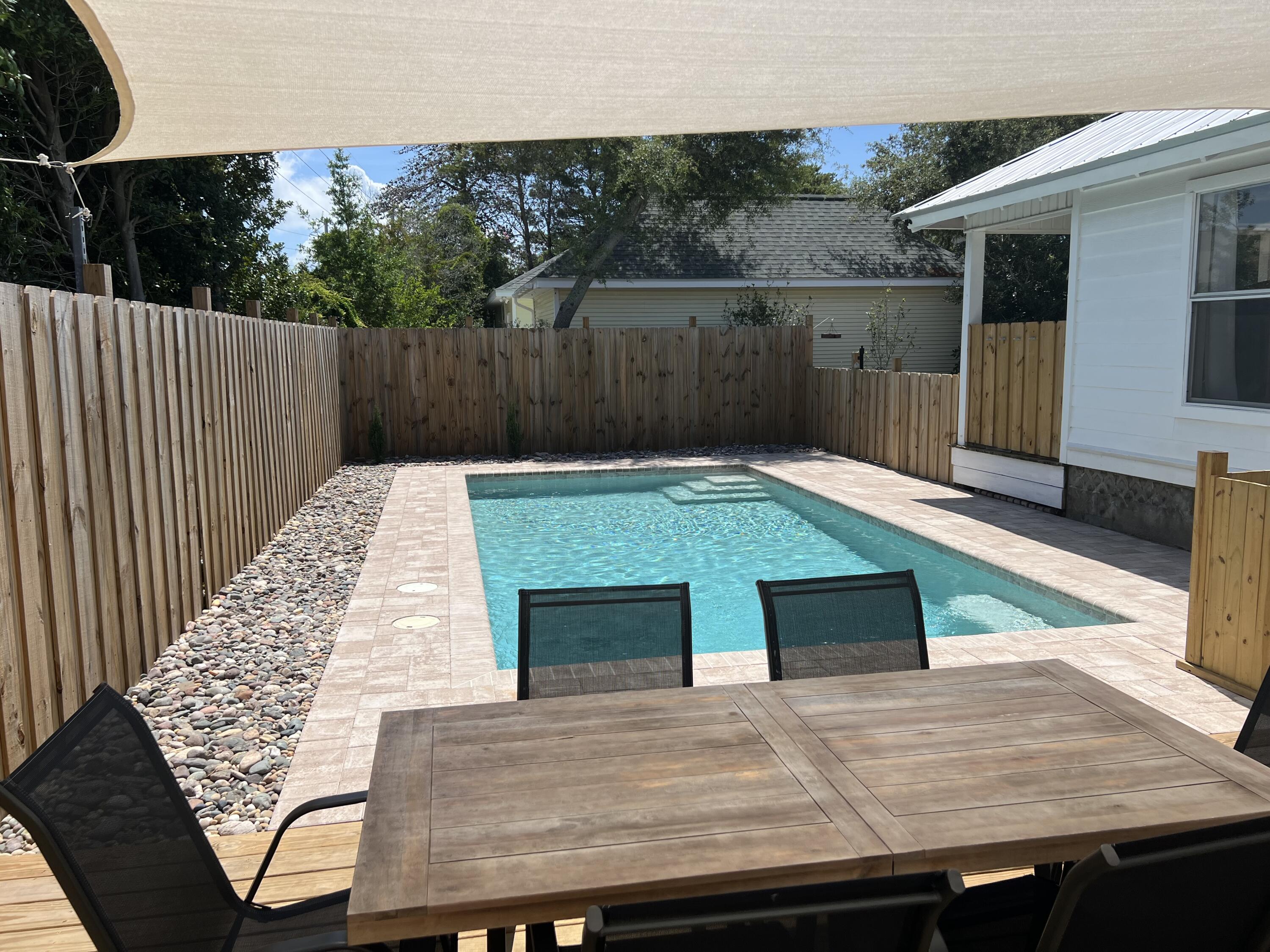 4485 Luke Avenue, Unit B Destin, FL 32541 - Photo 20 of 22 a view of outdoor space with seating