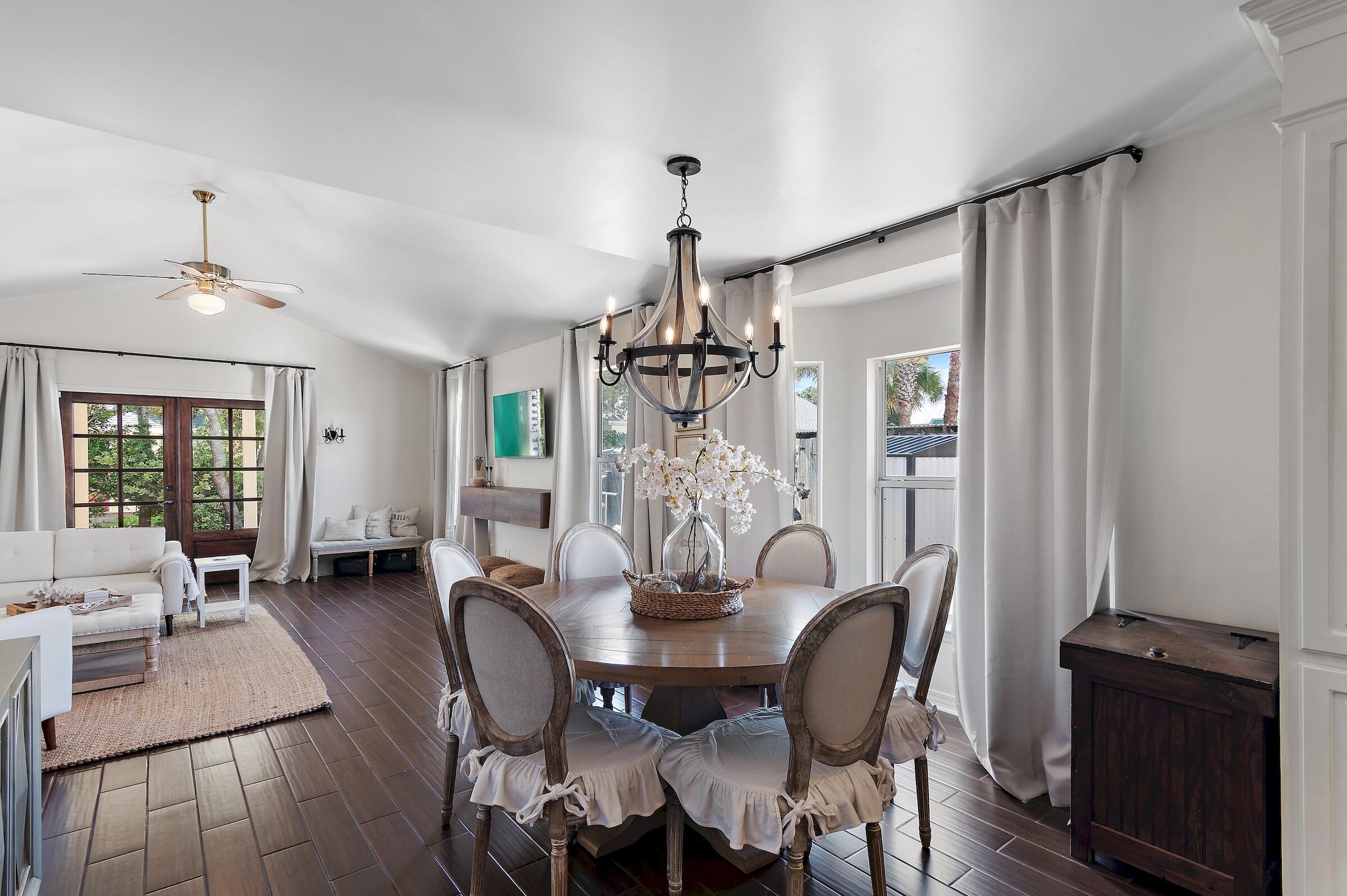 4485 Luke Avenue, Unit B Destin, FL 32541 - Photo 3 of 22 a view of a dining room with furniture window and wooden floor