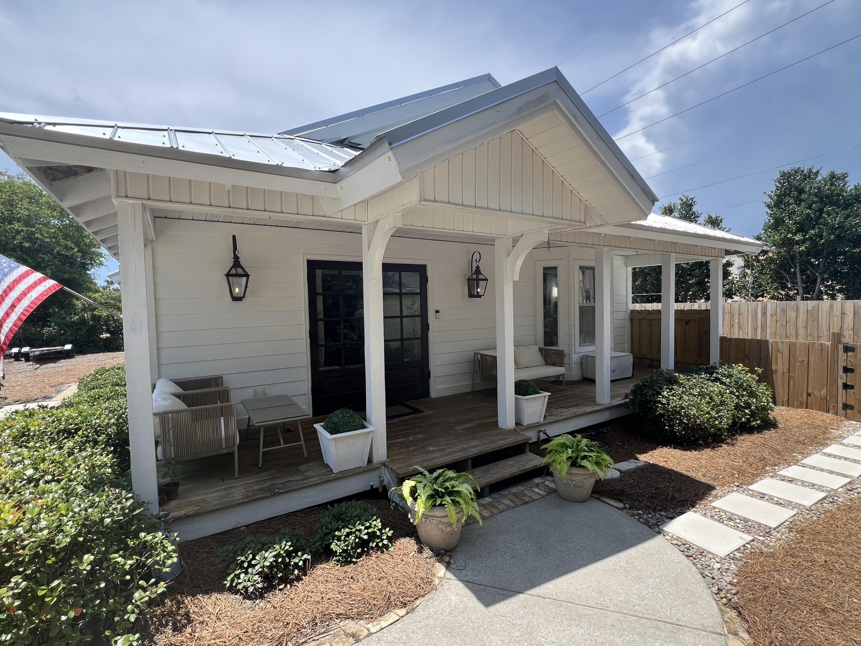 4485 Luke Avenue, Unit B Destin, FL 32541 - Photo 4 of 22 a front view of a house with garden