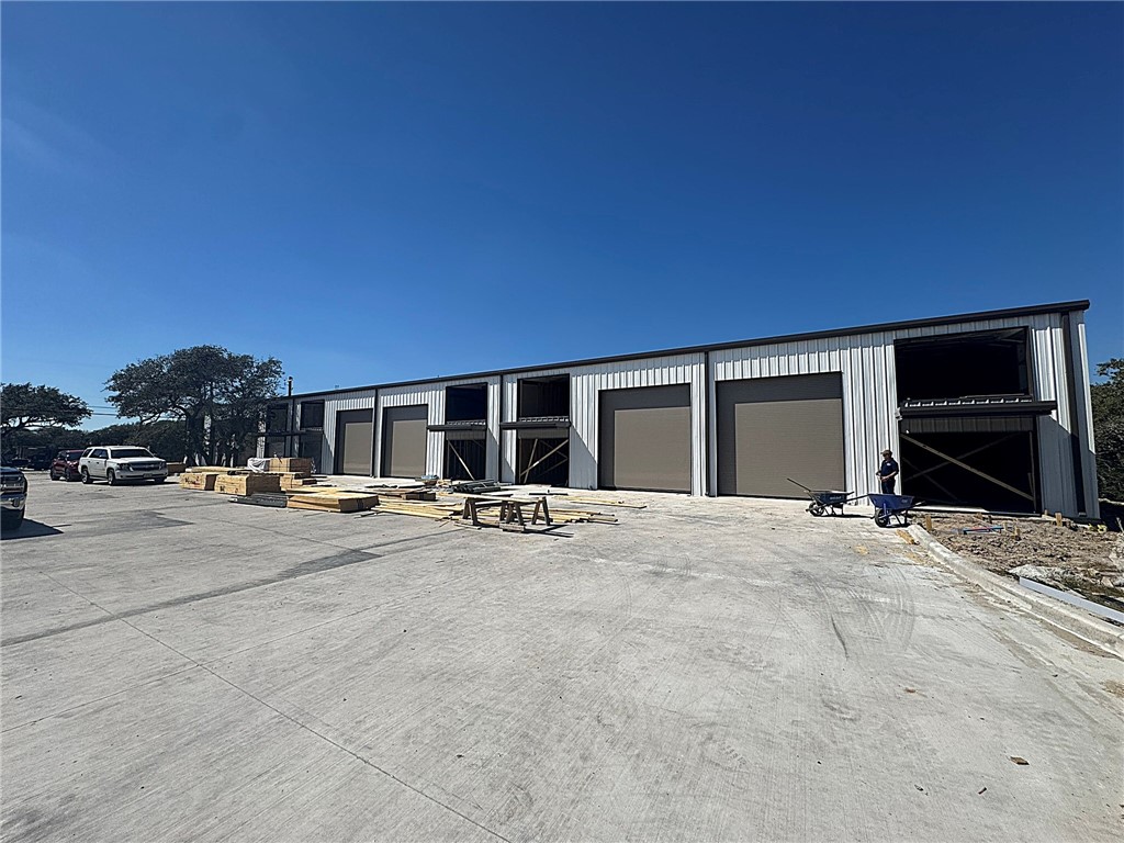 350 Shaver Road, Unit 103 Aransas Pass, TX 78336 - Photo 15 of 18 a view of a livingroom with patio and fireplace
