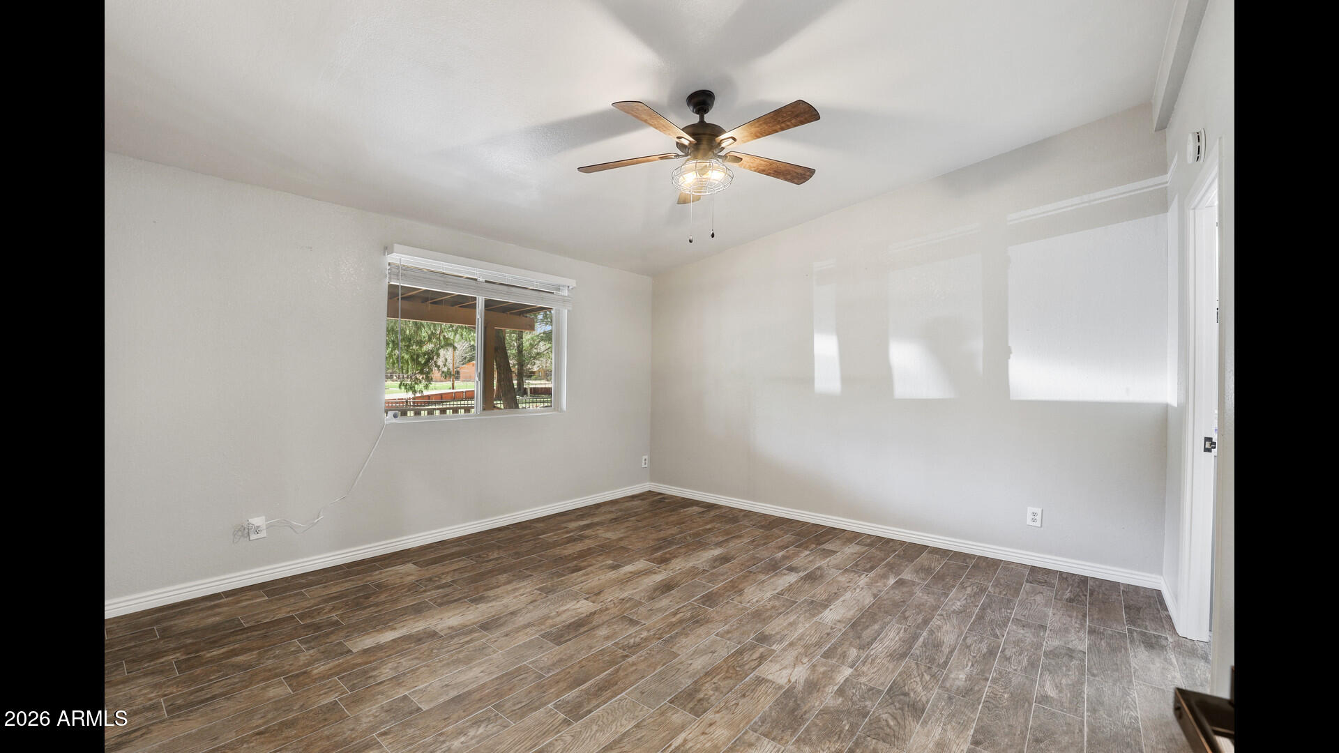 512 Standage Drive Payson, AZ 85541 - Photo 13 of 46 wooden floor in an empty room with a window
