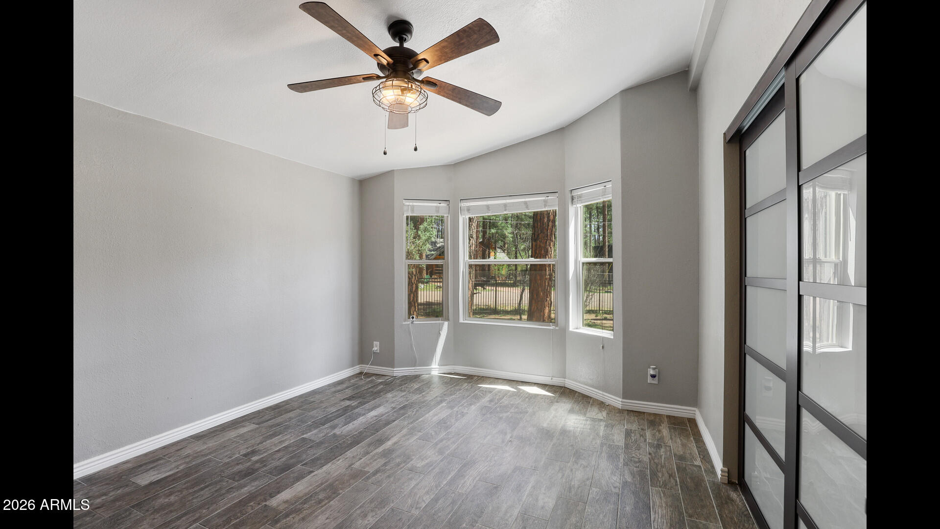 512 Standage Drive Payson, AZ 85541 - Photo 14 of 46 an empty room with wooden floor and windows