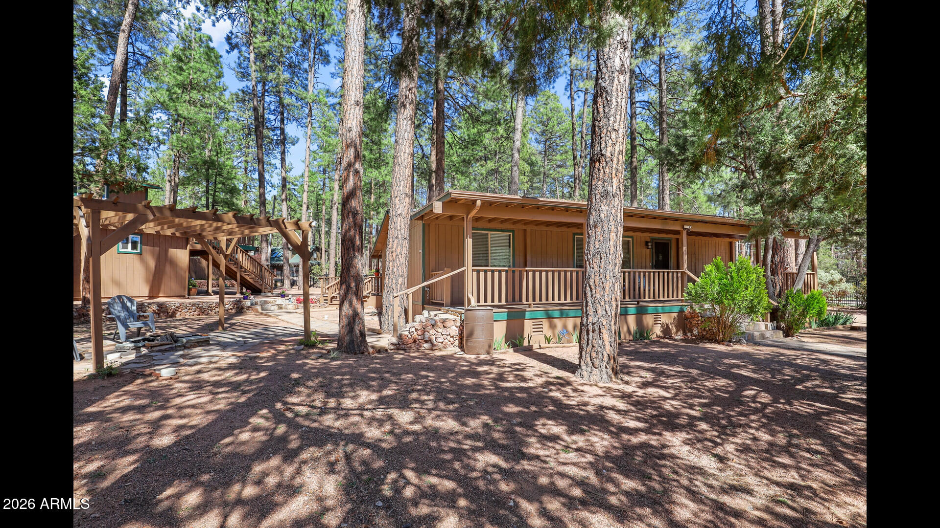 512 Standage Drive Payson, AZ 85541 - Photo 22 of 46 a view of a backyard with large trees and wooden fence