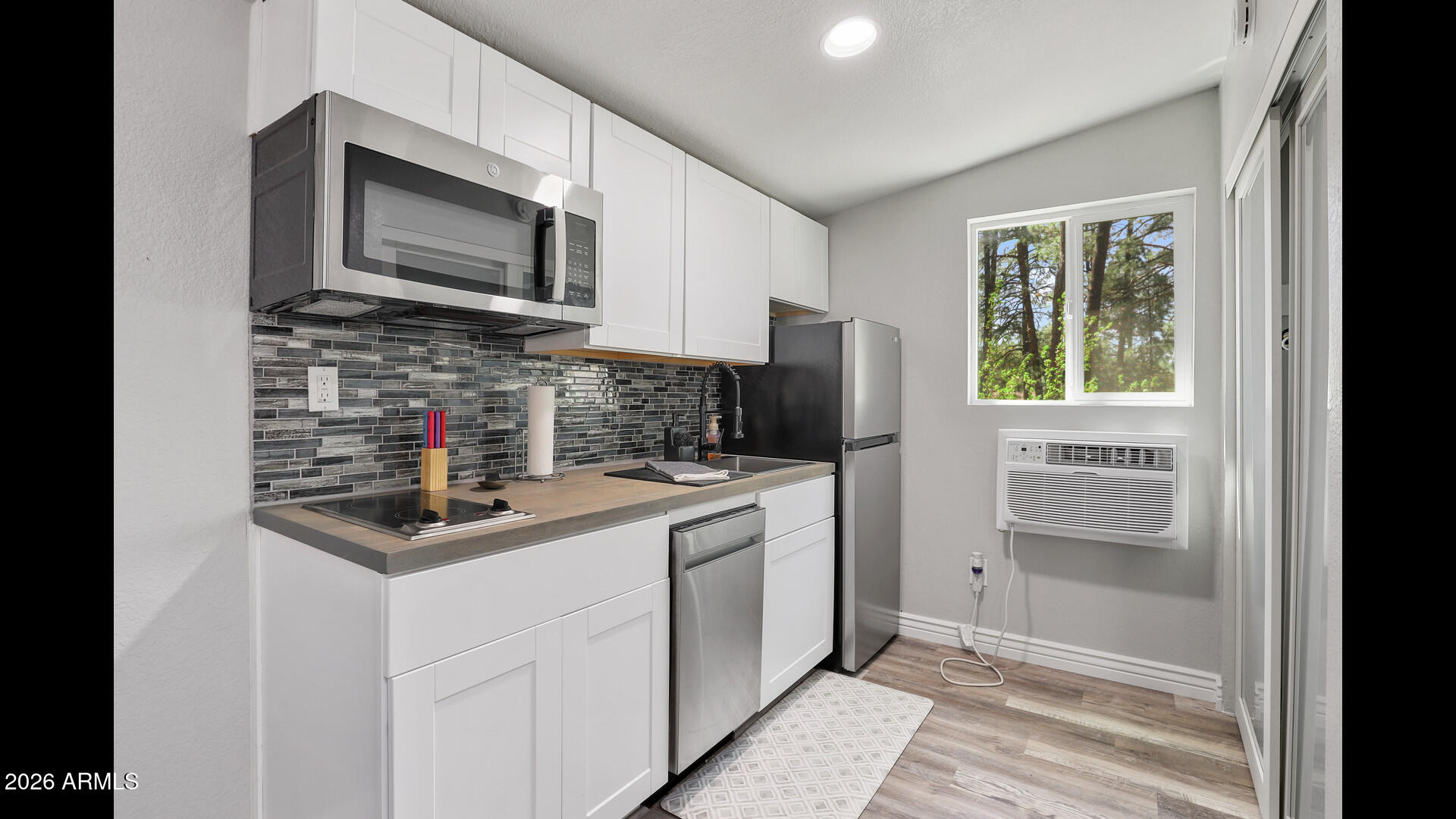 512 Standage Drive Payson, AZ 85541 - Photo 43 of 46 a kitchen with a stove microwave and refrigerator