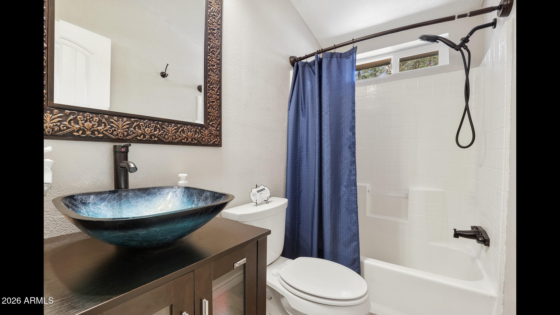 512 Standage Drive Payson, AZ 85541 - Photo 10 of 46 a bathroom with a toilet a sink and shower