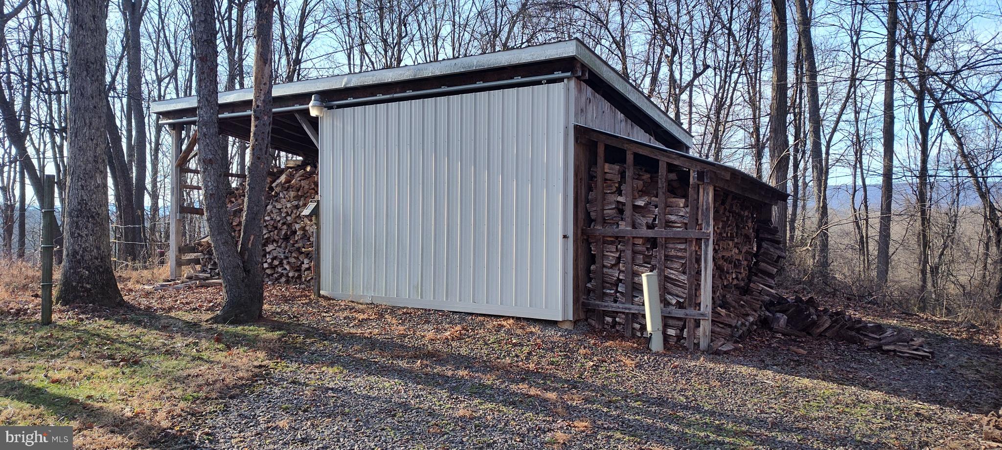 1339 Spruce Hill Road Port Royal, PA 17082 - Photo 21 of 126 a view of a house with a backyard and wooden fence