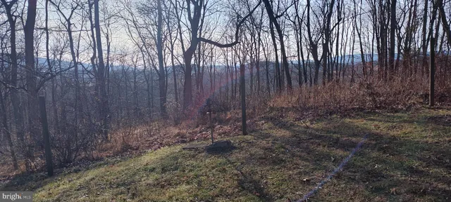 a view of living room kitchen with furniture and flat screen tv