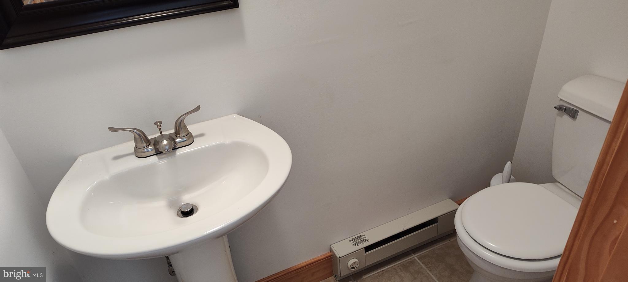 1339 Spruce Hill Road Port Royal, PA 17082 - Photo 33 of 126 a bathroom with a sink a toilet and mirror