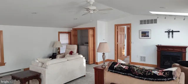 a view of a house with backyard and porch