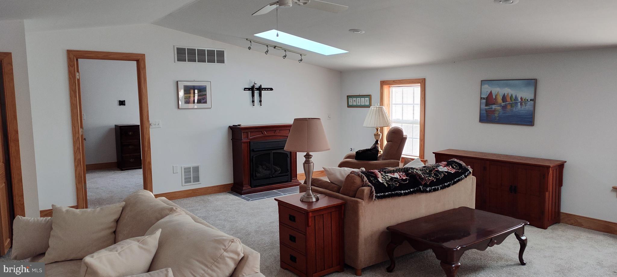 1339 Spruce Hill Road Port Royal, PA 17082 - Photo 35 of 126 a living room with furniture a fireplace and a window