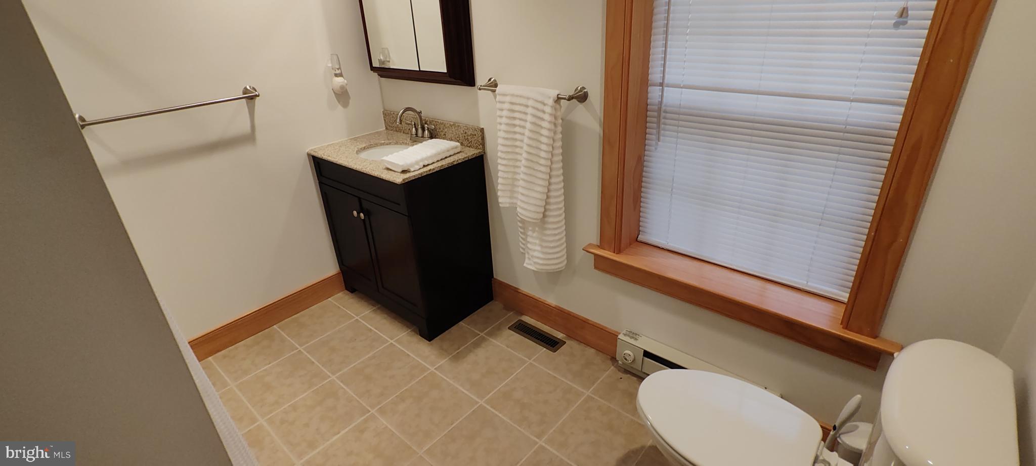 1339 Spruce Hill Road Port Royal, PA 17082 - Photo 39 of 126 a bathroom with a sink vanity mirror and toilet