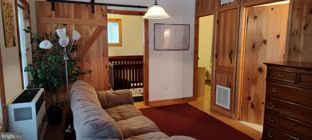 a living room with furniture and a gate