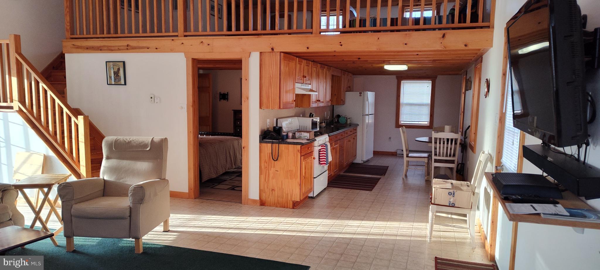 1339 Spruce Hill Road Port Royal, PA 17082 - Photo 44 of 126 a view of living room kitchen with furniture and flat screen tv