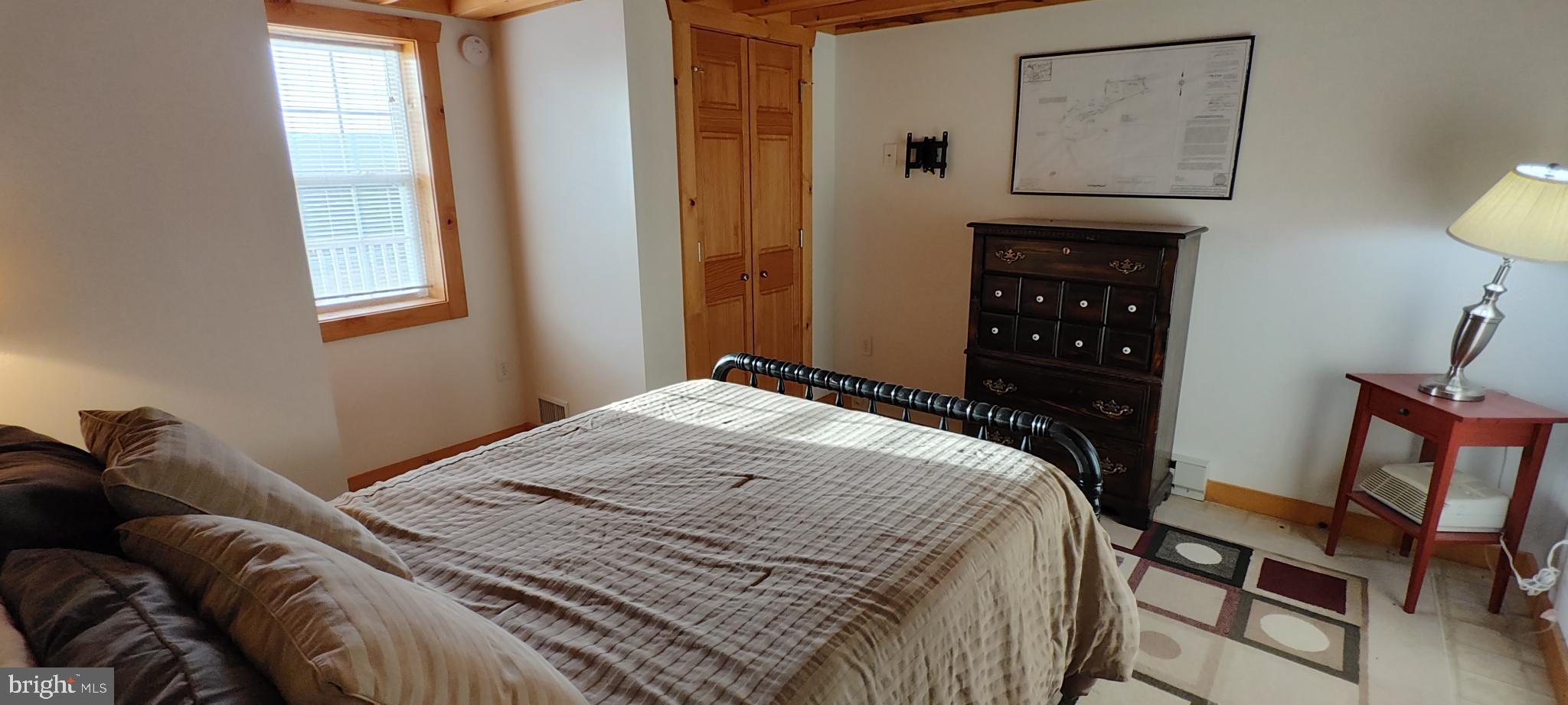 1339 Spruce Hill Road Port Royal, PA 17082 - Photo 48 of 126 a bedroom with a bed and a lamp on dresser