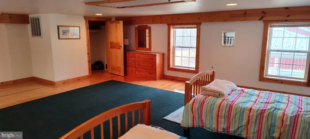 a view of a room with furniture and a window