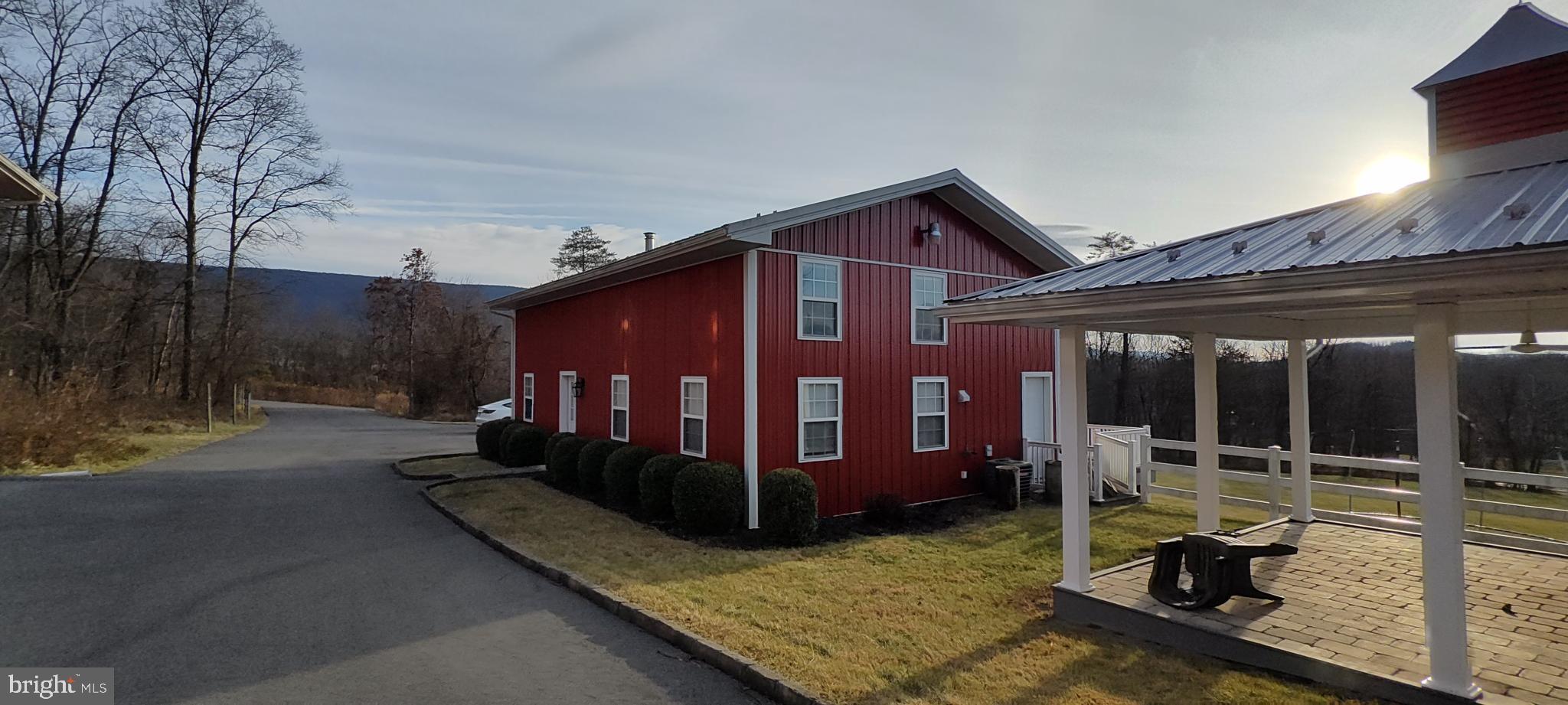 1339 Spruce Hill Road Port Royal, PA 17082 - Photo 51 of 114 a view of a house with a large window and wooden fence