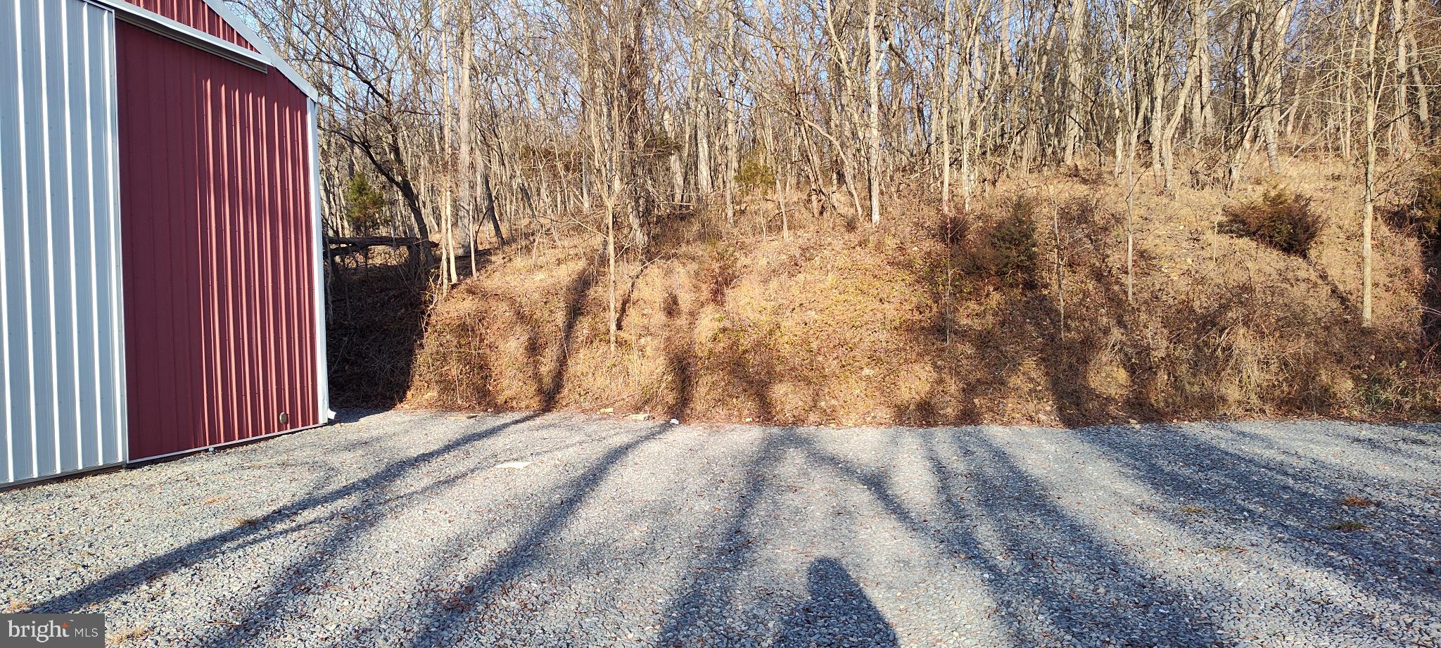 1339 Spruce Hill Road Port Royal, PA 17082 - Photo 83 of 114 Serene gravel space beneath gentle shadows.