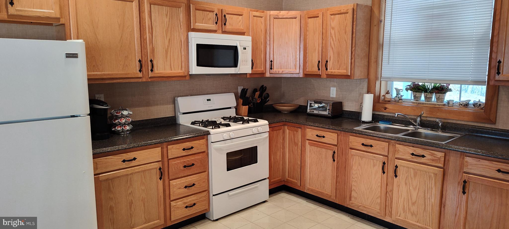 1339 Spruce Hill Road Port Royal, PA 17082 - Photo 9 of 114 a kitchen with granite countertop cabinets stainless steel appliances and a sink