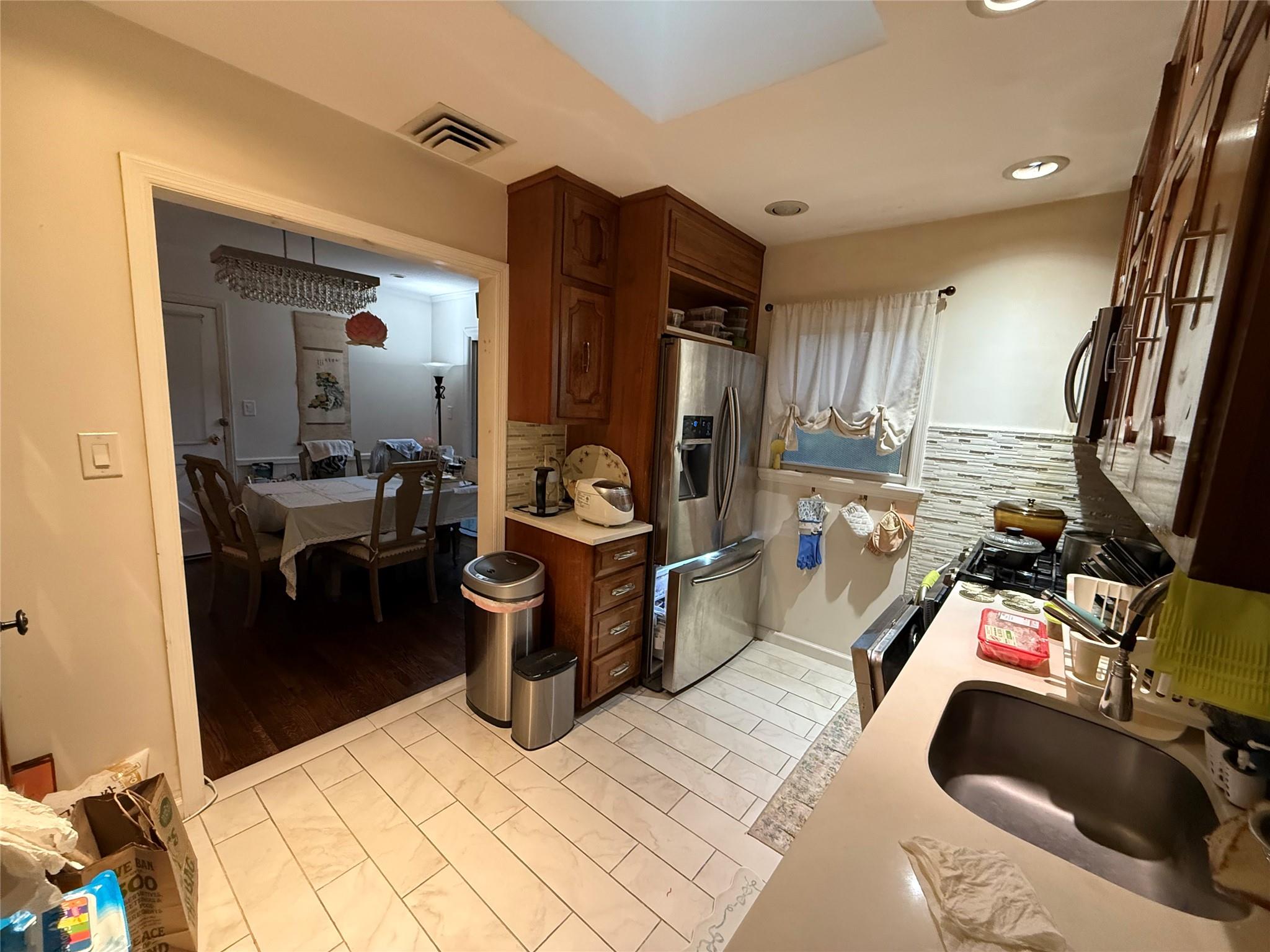 64-47 215th Street Queens, NY 11364 - Photo 5 of 15 a view of a living room and bathroom