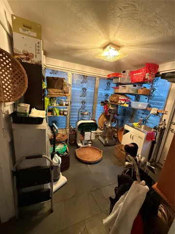 a room with furniture and a lamp