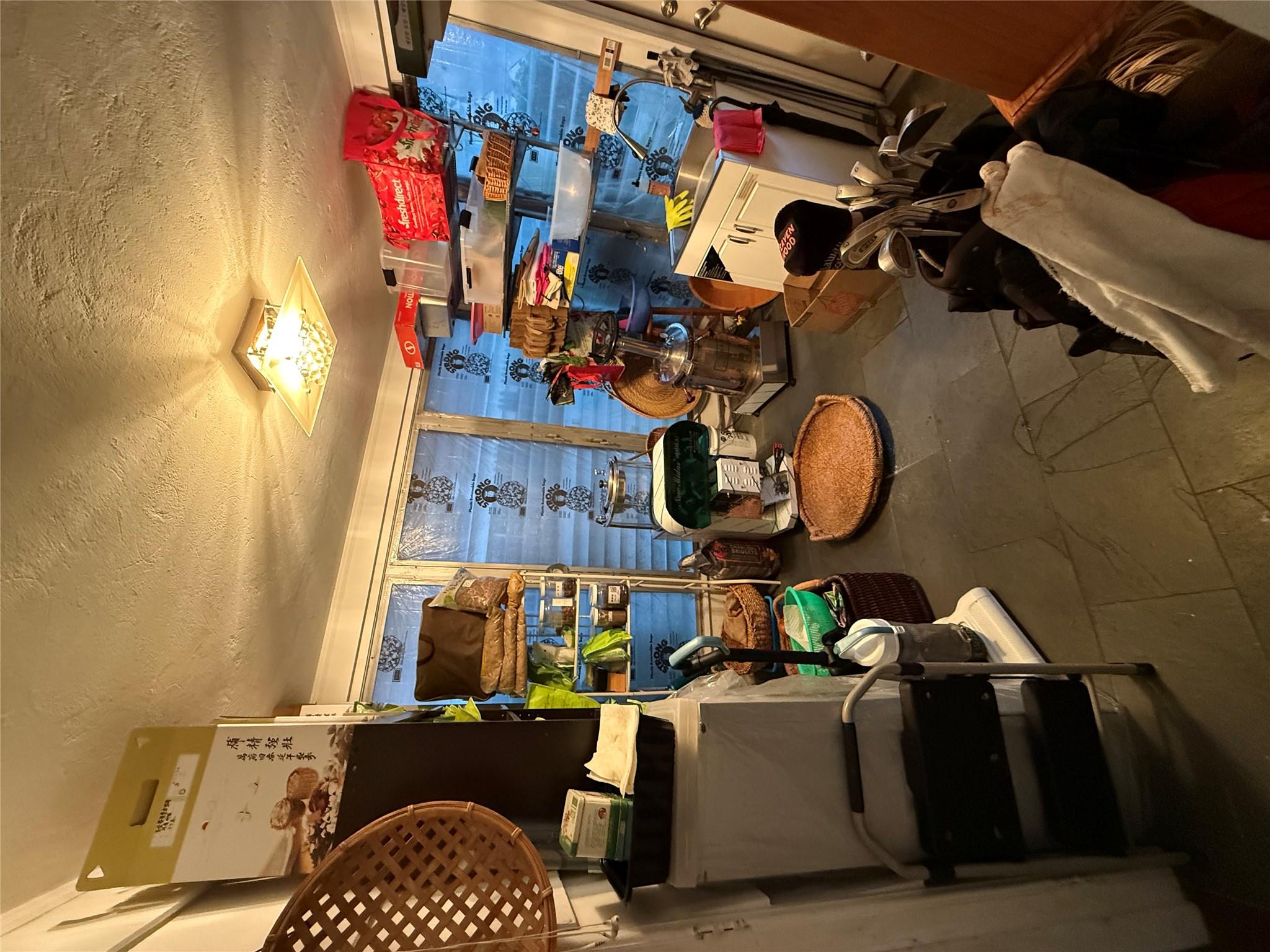 64-47 215th Street Queens, NY 11364 - Photo 6 of 15 a room with furniture and a lamp