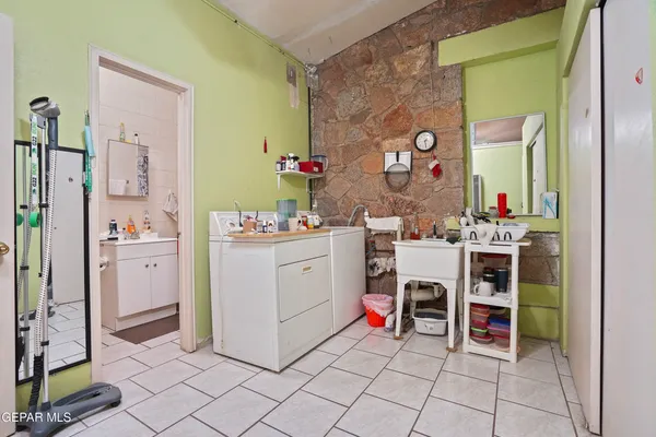 a room with furniture a washer and dryer