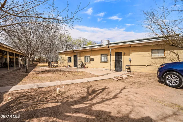 a view of a house with snow on the road