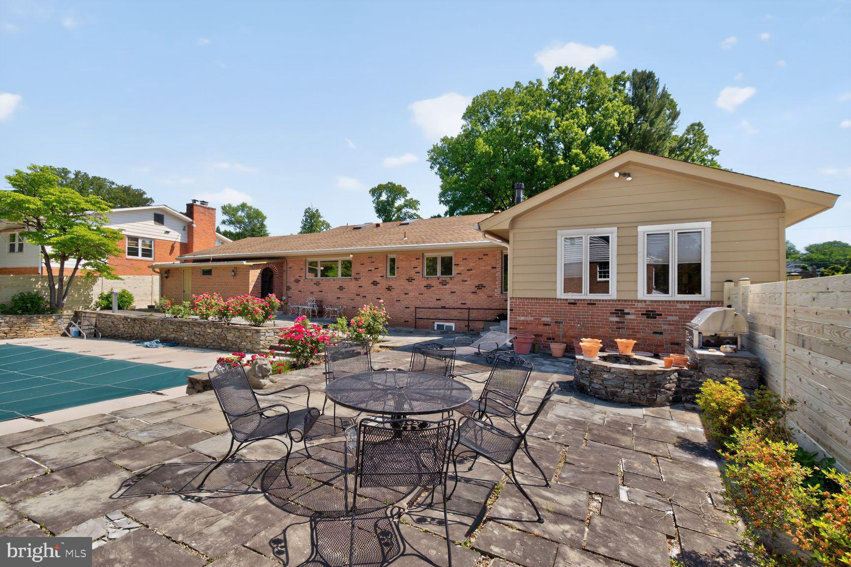 5800 Plainview Road Bethesda, MD 20817 - Photo 22 of 30 a backyard of a house with yard barbeque oven and outdoor seating