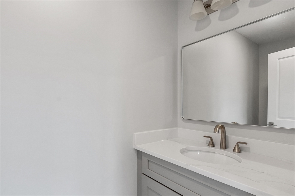 10 Windsor Street Worcester, MA 01605 - Photo 16 of 26 a bathroom with a sink and a mirror