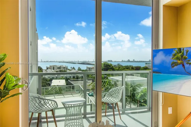 a view of a balcony with chair and table