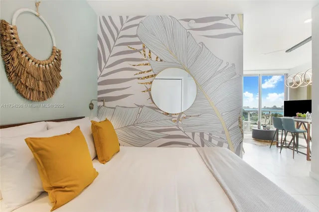 a living room with a couch and chandelier