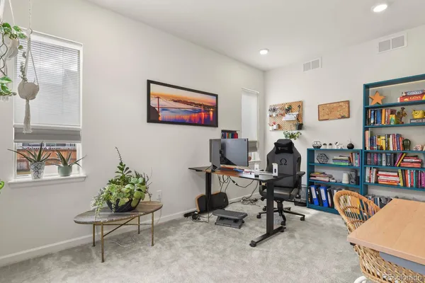 a view of a workspace with furniture