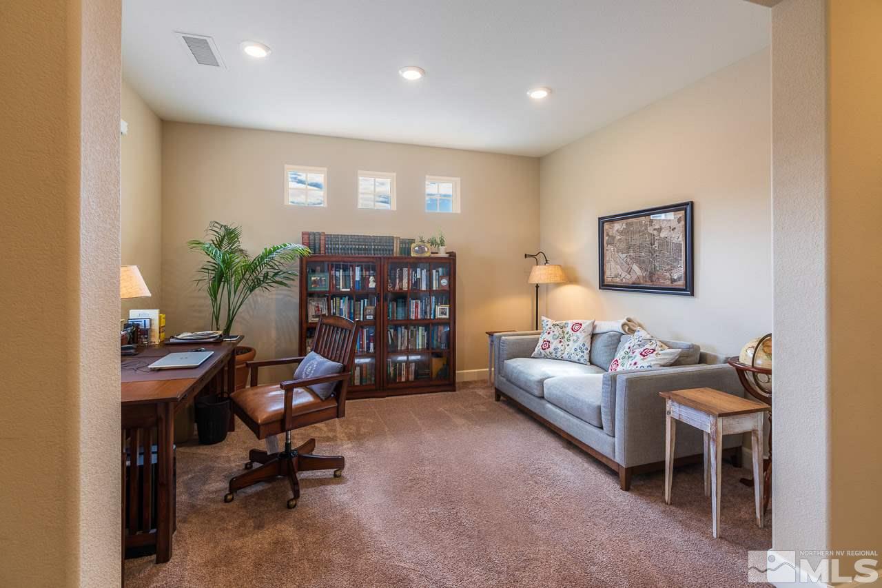 10155 Toltec Court Reno, NV 89521 - Photo 11 of 19 a living room with furniture and a bookshelf